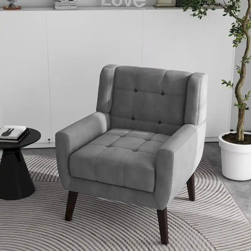 Gestoffeerde loungefauteuil met gecapitonneerde armleuningen
