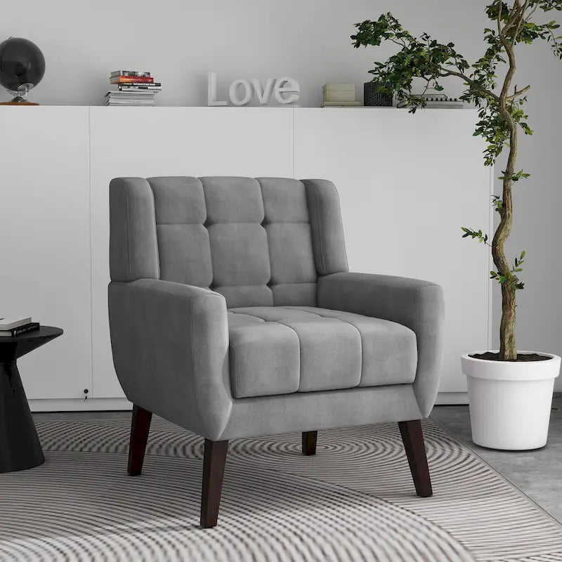 Gestoffeerde loungefauteuil met gecapitonneerde armleuningen
