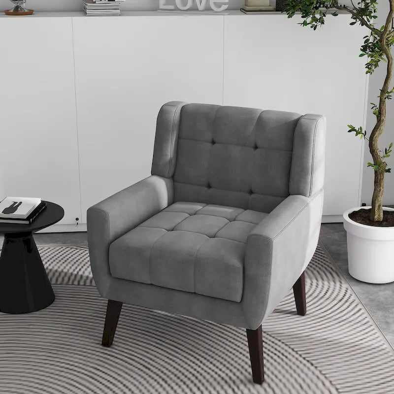 Gestoffeerde loungefauteuil met gecapitonneerde armleuningen