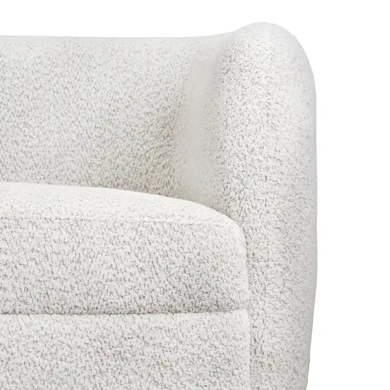Canapé en bouclé moderne à accoudoirs courbés, assise en forme de rein et pieds ronds en bois