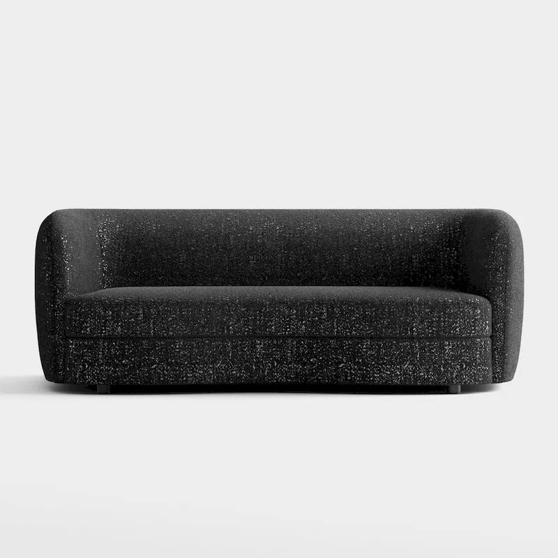 Canapé en bouclé moderne à accoudoirs courbés, assise en forme de rein et pieds ronds en bois