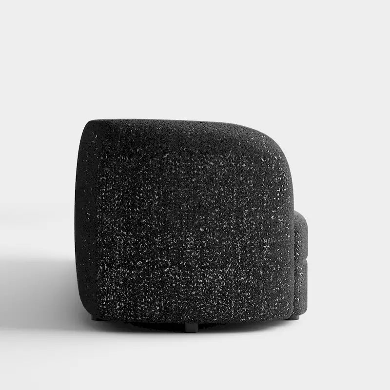 Canapé en bouclé moderne à accoudoirs courbés, assise en forme de rein et pieds ronds en bois