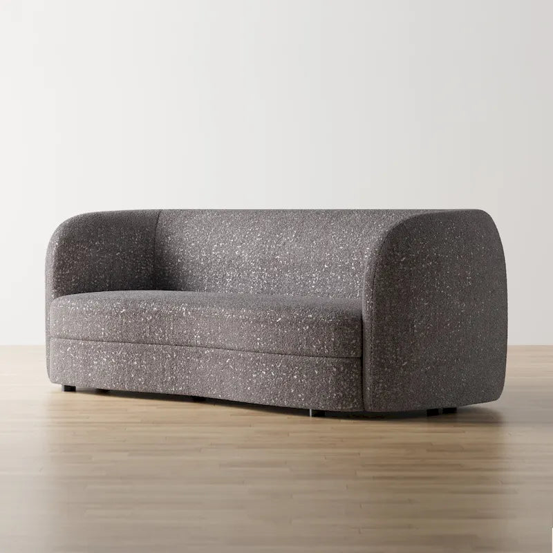 Canapé en bouclé moderne à accoudoirs courbés, assise en forme de rein et pieds ronds en bois
