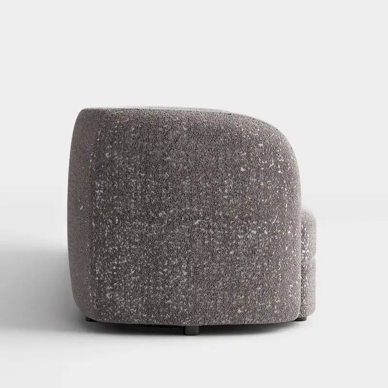 Canapé en bouclé moderne à accoudoirs courbés, assise en forme de rein et pieds ronds en bois
