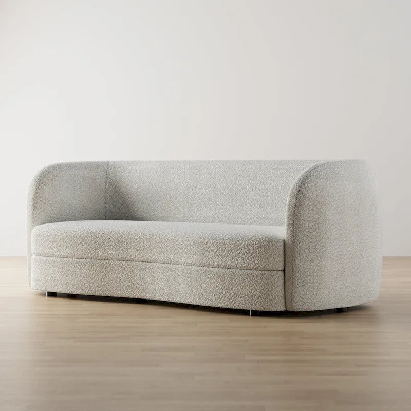 Canapé en bouclé moderne à accoudoirs courbés, assise en forme de rein et pieds ronds en bois