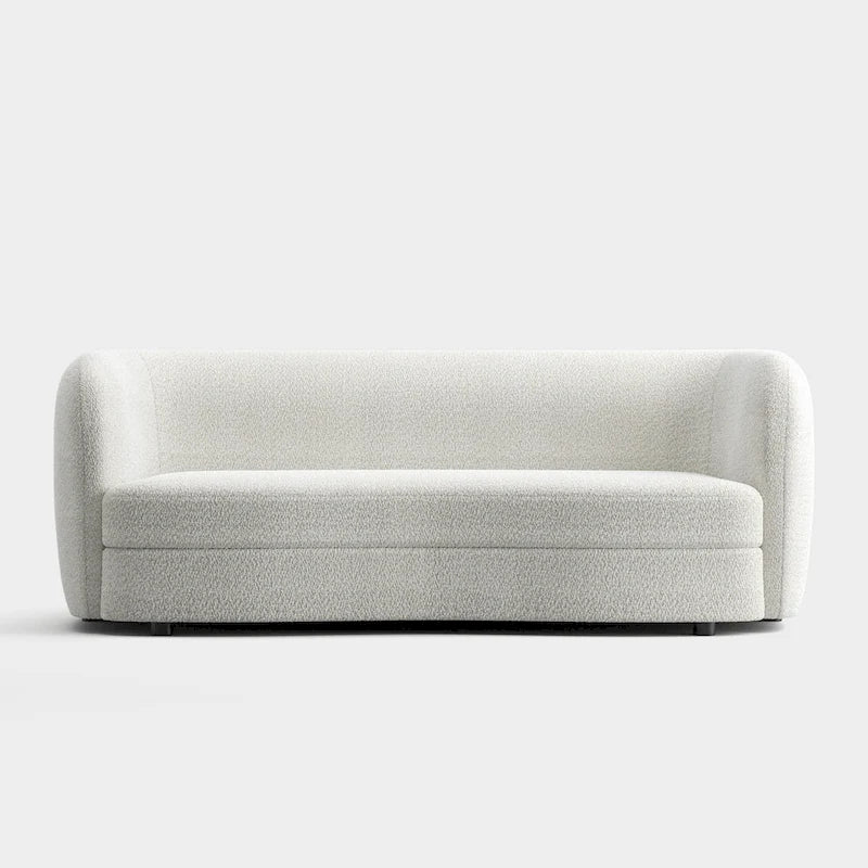 Canapé en bouclé moderne à accoudoirs courbés, assise en forme de rein et pieds ronds en bois