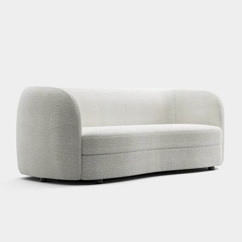 Canapé en bouclé moderne à accoudoirs courbés, assise en forme de rein et pieds ronds en bois