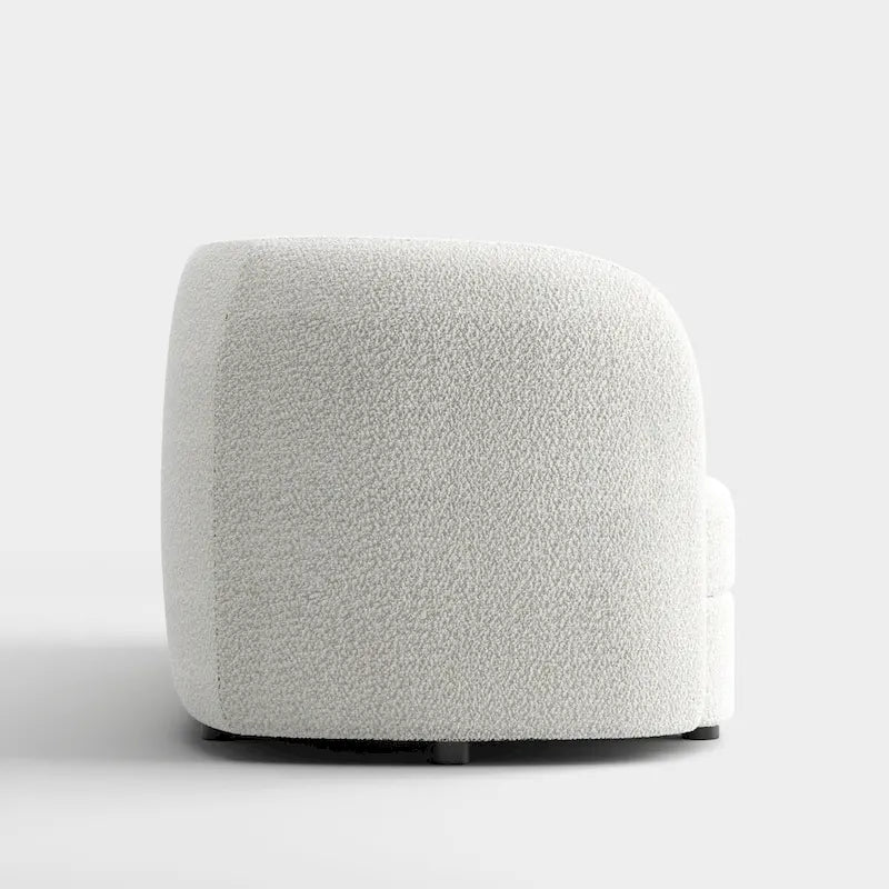 Canapé en bouclé moderne à accoudoirs courbés, assise en forme de rein et pieds ronds en bois